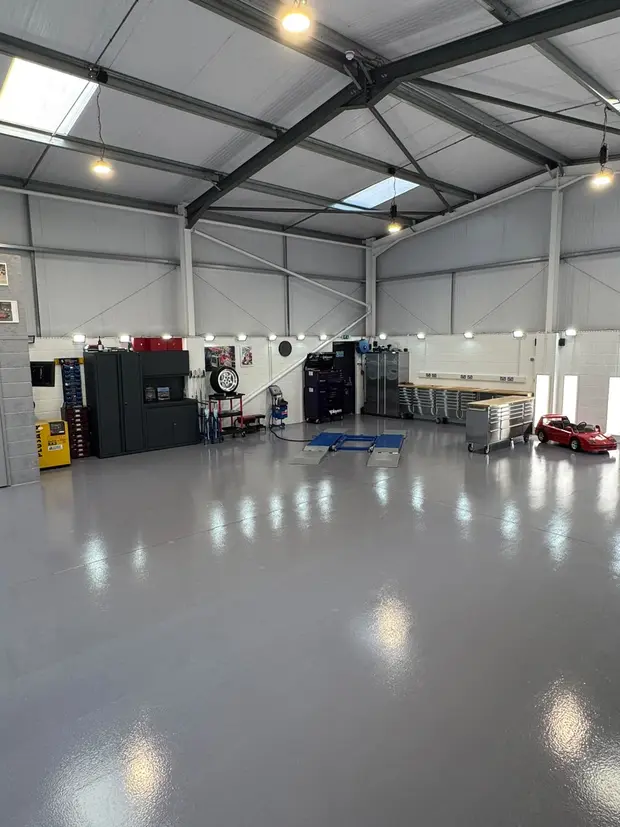 The fitted adjoining ALC Elite workshop unit, with a resin floor, ramp and tool storage