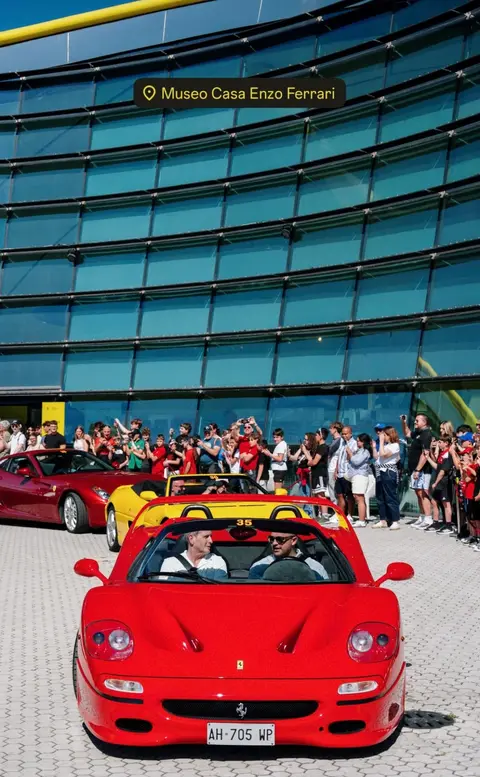 A red Ferrari F50 with the roof removed, photographed outdoors at the Cavallino Classic event in Modena, with an interior view and event details